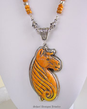  Francisco Gomez carved Orange spiny oyster shell horse portrait on Schaef Designs Jewelry Sterling silver & spiny oyster necklace | Schaef Designs Southwestern Native American & Equine Jewelry | Online upscale Southwestern artisan handcrafted collectible jewelry gallery boutique | New Mexico 